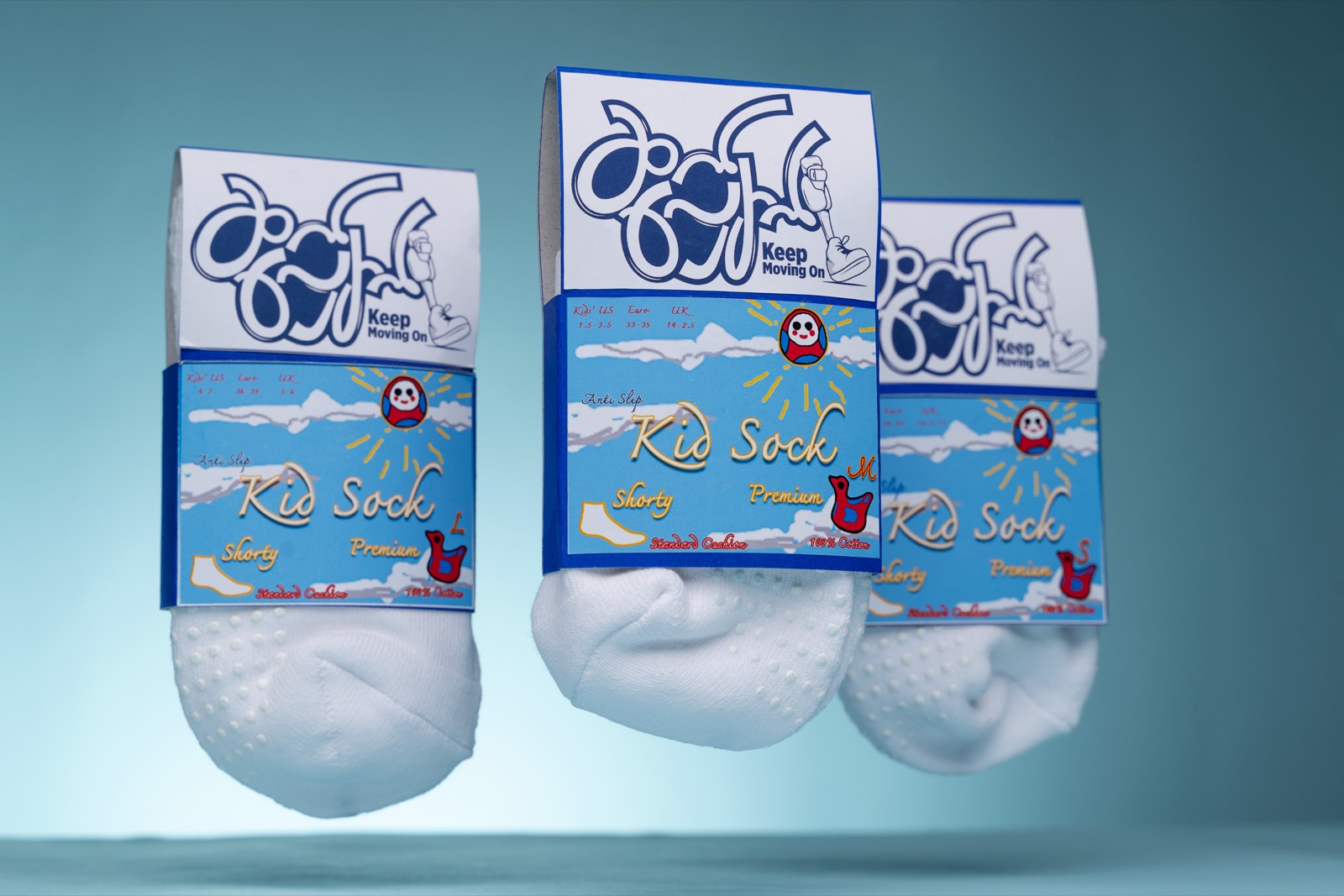 Five pairs of white kid's socks and packaging on a pale blue background.